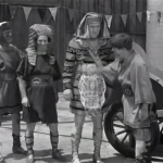 Mummy's Dummies - the Three Stooges (Moe, Larry, Shemp) as used chariot salesmen try to fleece the Chief of the Guards (Ralph Dunn)