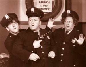 Moe, Larry and Curly as policemen - with Curly's gun drawn