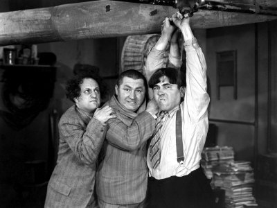 The Three Stooges (Moe Howard, Larry Fine, Curly Howard) as inept plumbers in a scene from their short film A-Plumbing We Will Go (1940).